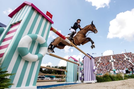 Scott Brash on board Jefferson tackles a jump on the way to gold