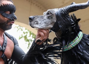 Steve Sanders and his Great Dane, Shadow, dressed as Maleficent on stage at the the 31st annual Tompkins Square Halloween dog parade in New York.
