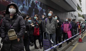 Citizens line up to buy face masks