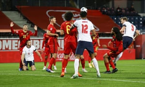 Kane heads the ball towards goal only to see Romelu Lukaku clear his effort off the line.