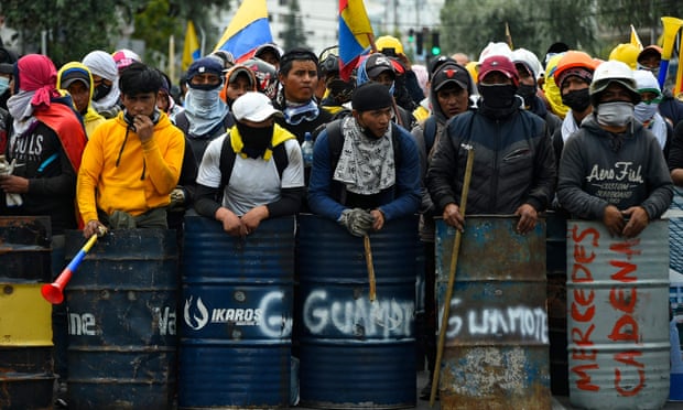 Indigenous men prepare to march in Quito, on 22 June 2022, on the tenth consecutive day of Indigenous-led protests against the Ecuadorean government. 