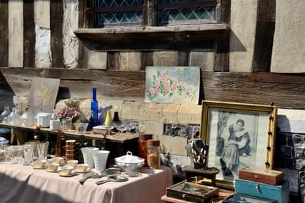 Wares laid out in front of a Tudor property