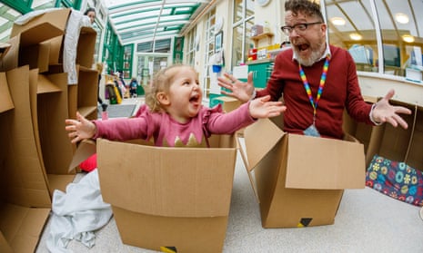Head teacher Matt Caldwell at Ilminster Avenue Nursery School in Bristol and toddler in cardboard boxes