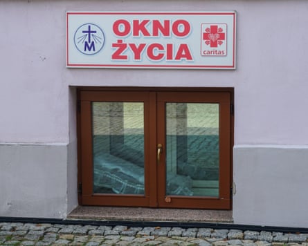 A baby hatch with Polish wording above it