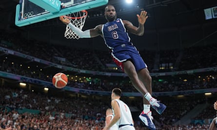 LeBron James dunks the ball during USA’s 110-84 win over Serbia.