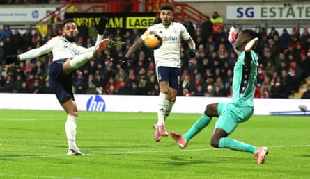 Douglas Luiz stretches to get a shot off against Wrexham in the FA Cup.