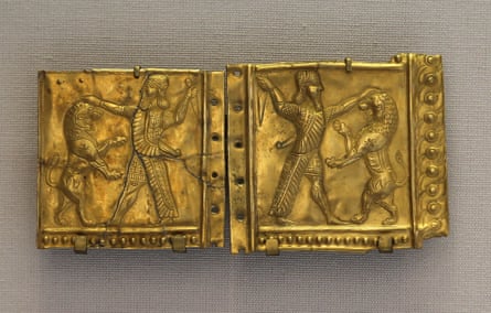 A gold plate from the Ziwiye hoard showing a character fighting a lion
