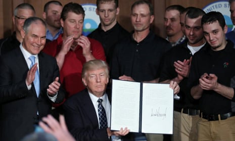 Donald Trump, with Scott Pruitt and a group of miners, after signing an executive order on ‘energy independence’ in Washington.