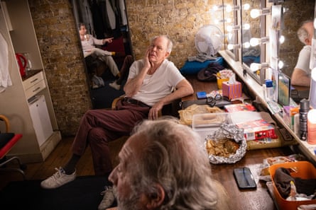 John Lithgow plays word games with fellow cast-members Elliot Levey and Richard Hope, in their dressing room at the Royal Court theatre, before their performance in Giant.