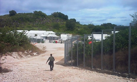 A guard walks towards the entrance of the Nauru detention centre. This photo was one of number of images received by Guardian Australia in May 2015, depicting life and conditions for asylum seekers on Nauru. Photo supplied by an unnamed source. Background info supplied by the picture editor: Nauru is an island in the South Pacific which has detention centres for asylum seekers, run by Australia’s immigration services. Some asylum seekers are granted asylum (refugee status) to live on the island in open camps.