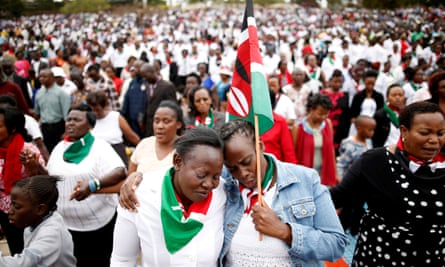 Kenyans pray during a rally in Nairobi calling for peace before the election.