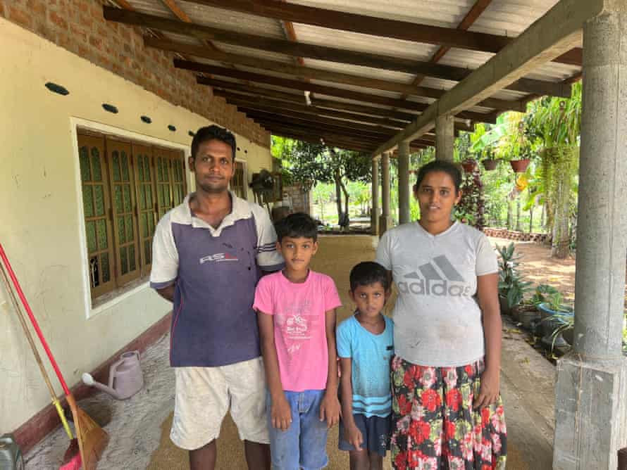Rice farmer Niluka Dilrukshi with his wife, Milinda, and their two children.