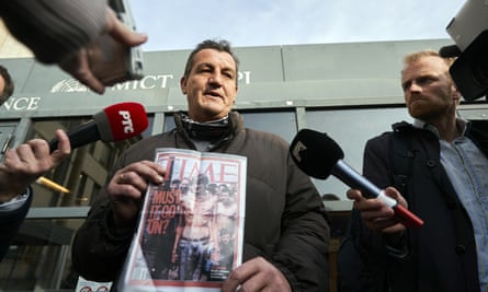 Fikret Alic holds a copy of Time magazine which featured his emaciated image on its cover in 1992. He was outside court when Mladic was sentenced to life in prison for atrocities perpetrated during Bosnia’s 1992-1995 war