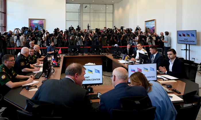 Military delegations of Turkey, Russia and Ukraine sit at the opening of the coordination centre for Ukrainian grain exports.