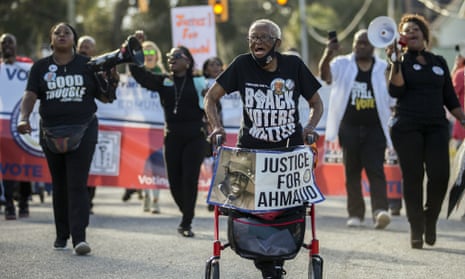 Annie Polite, 87, leads a protest march outside the Glynn county courthouse during the trial of three men accused of murdering Ahmaud Arbery.