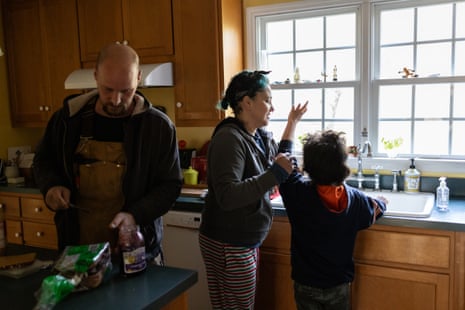 A family of three in the kitchen