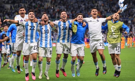 Messi celebrates with his Argentina teammates.