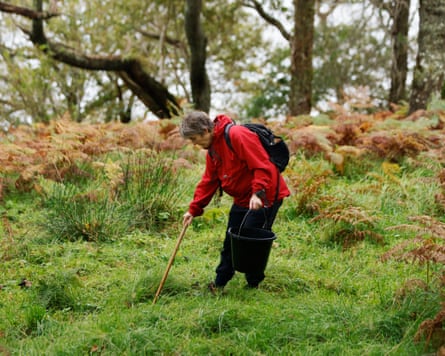 Roz Birch using a stick to search the ground.