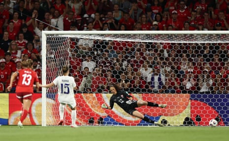 Finland's Natalia Kuikka scores their first goal from the penalty spot past Switzerland's keeper Livia Peng.