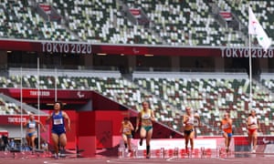 Xia Zhou (second left) of China breaks the world record and wins the gold medal in the Women’s 100m - T35 final.