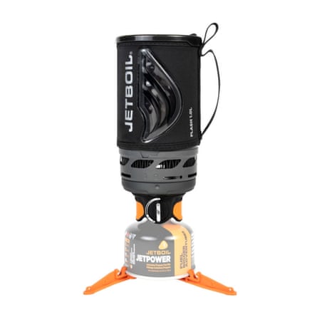 A Jetboil Fast Cooking System. The canister has orange feet.
