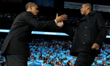 Barack Obama is greeted on stage by Jay Z in 2012.