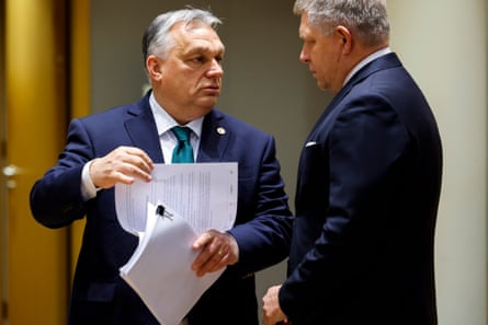 Slovakia’s prime minister Robert Fico, right, talks to Hungary’s Prime Minister Viktor Orbán during a round table meeting