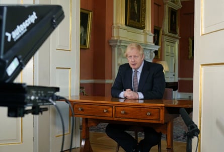Boris Johnson addresses the nation from behind a back-to-front desk wedged into a Downing Street doorframe, 10 May 2020.