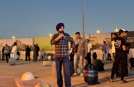 Mideast Wars Saudi ArabiaPeople gather outside a metro station on the road to King Khalid International Airport in Riyadh, Saudi Arabia, Saturday, Oct. 10, 2026. (AP Photo)