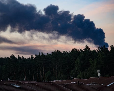 Smoke rises over trees and rooftops following a Ukrainian drone attack near Domodedovo in the Moscow Region, Russia.