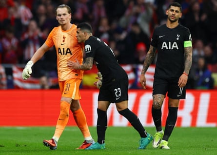 Tottenham Hotspur's Antonin Kinsky with Pedro Porro after being substituted at Atlético Madrid.