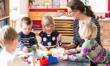 Sweden, children playing with teacher in kindergarten