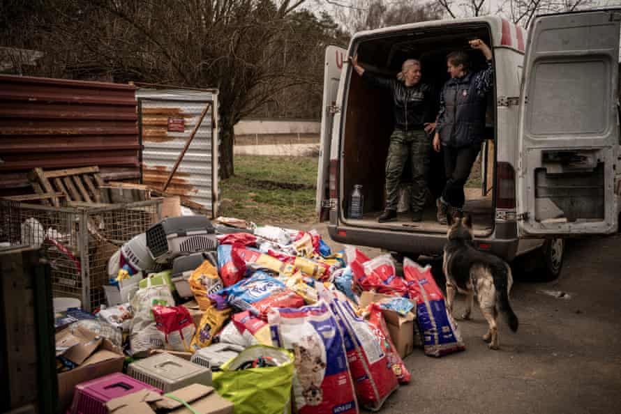 Nataliya Popova and her partner look pleased as they unload food and veterinary medicines for the wildlife center she runs on the outskirts of Kyiv