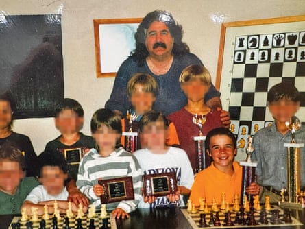 Danny (in yellow) with church leader Steven Kamp and other members of the Shelby school chess team.