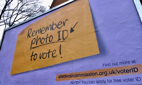A billboard saying remember photo ID to vote.