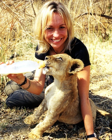 Michaela Strachan, feeds a lion cub for The Really Wild Show Pride Special in 2004, in South Africa.