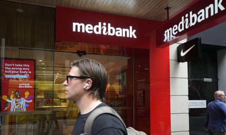 A man walks past a Medibank branch in Sydney 