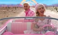 In a scene from the film Barbie, Barbie, played by Margot Robbie, and Ken, played by Ryan Gosling, drive through the desert.