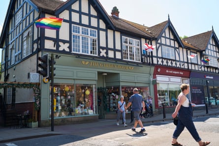 Shops with flags above and pedestrians