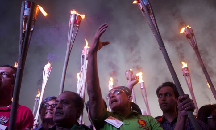 Activists in Bangladesh take part in a torchlight protest against the killing of a secular blogger