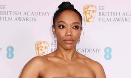 Naomi Ackie poses in front of a backdrop for the EE British Academy Film Awards.