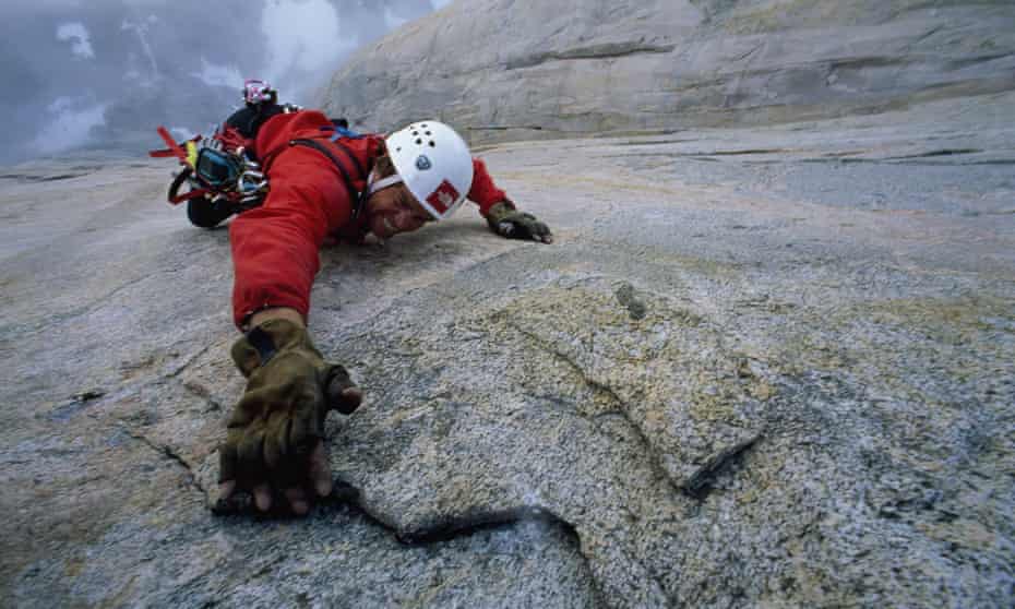 Alex Lowe climbs at Great Sail Peak, Baffin Island, Nunavut, Northwest Territories, Canada.