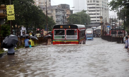 Heavy rain and flooded streets bring Mumbai to a virtual standstill.