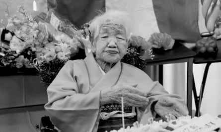 A black and white photograph of an elderly woman wearing what appears to be a kimono.