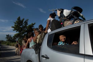 When a truck finally stops by to take some passengers, the few lucky ones often have to fight for space.