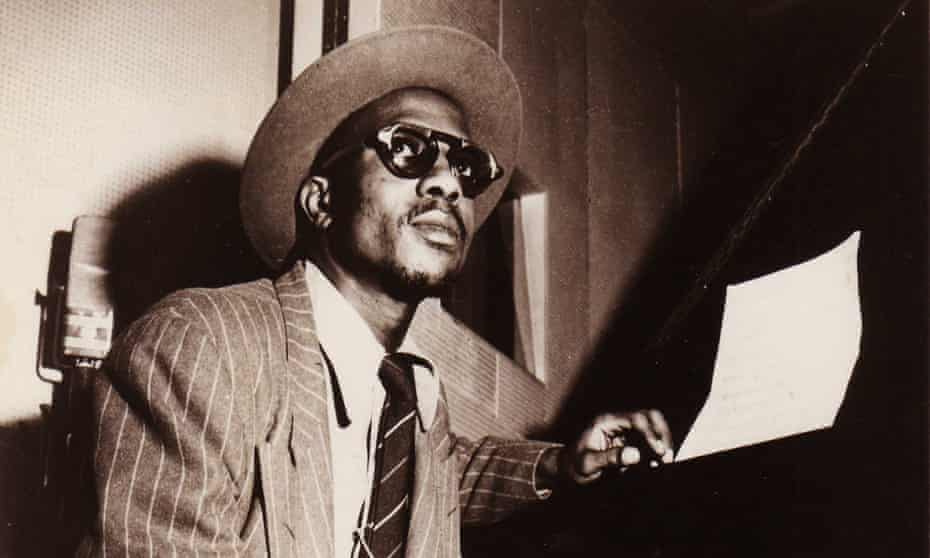 thelonious monk seated at a piano in about 1950