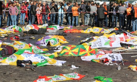 Bodies of victims of Saturday’s bomb blasts in Ankara are covered with flags and banners