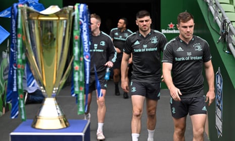 Leinster's players walk past the Champions Cup trophy as they arrive for a training session at the Aviva Stadium in Dublin on Friday