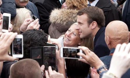 Macron poses with supporters in Le Touquet.