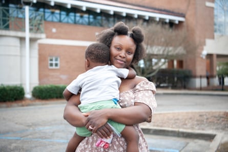 a woman holding a child